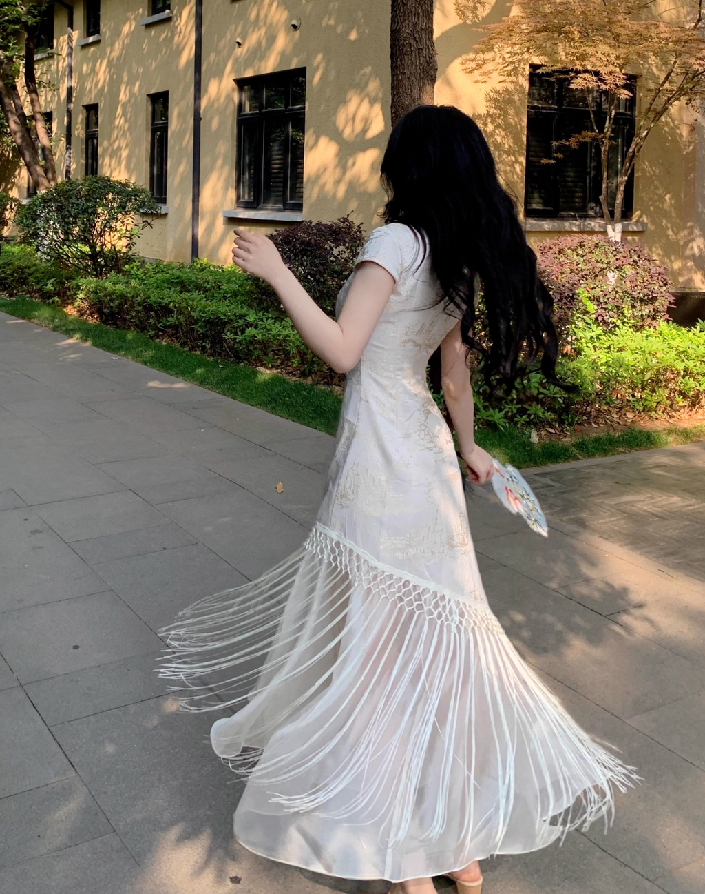 back of  a Platinum White Tassel Qipao Maxi Dress