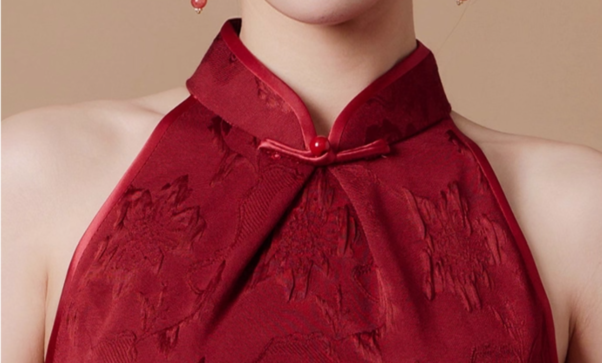 Red embroidered qipao dress with a close-up of the neckline